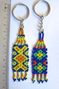 Keyfobs in assorted colours - Left- Vinusak (bud of the flower) - Right- Batu (flower in bloom) Traditional motifs by the native Rungus of Sabah, Borneo